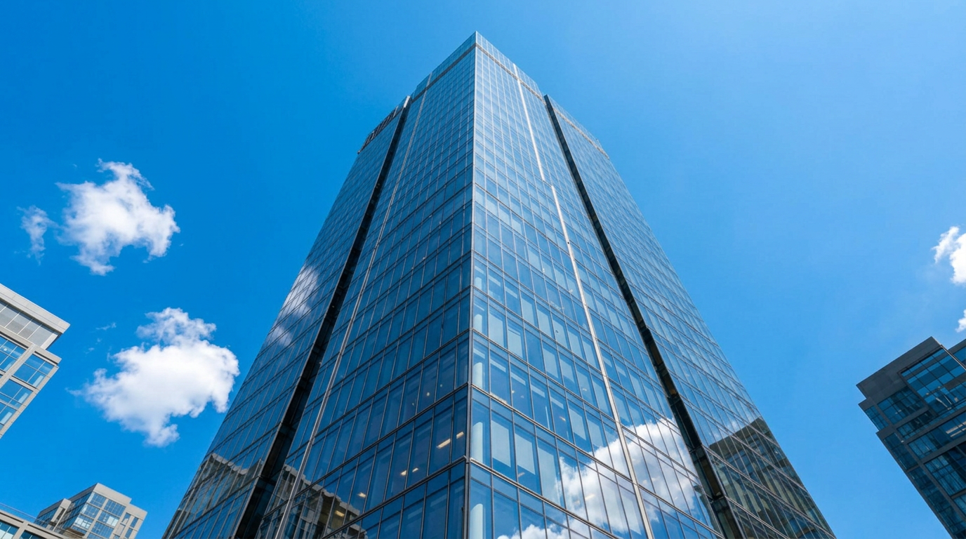 Office tower under clear midday sky